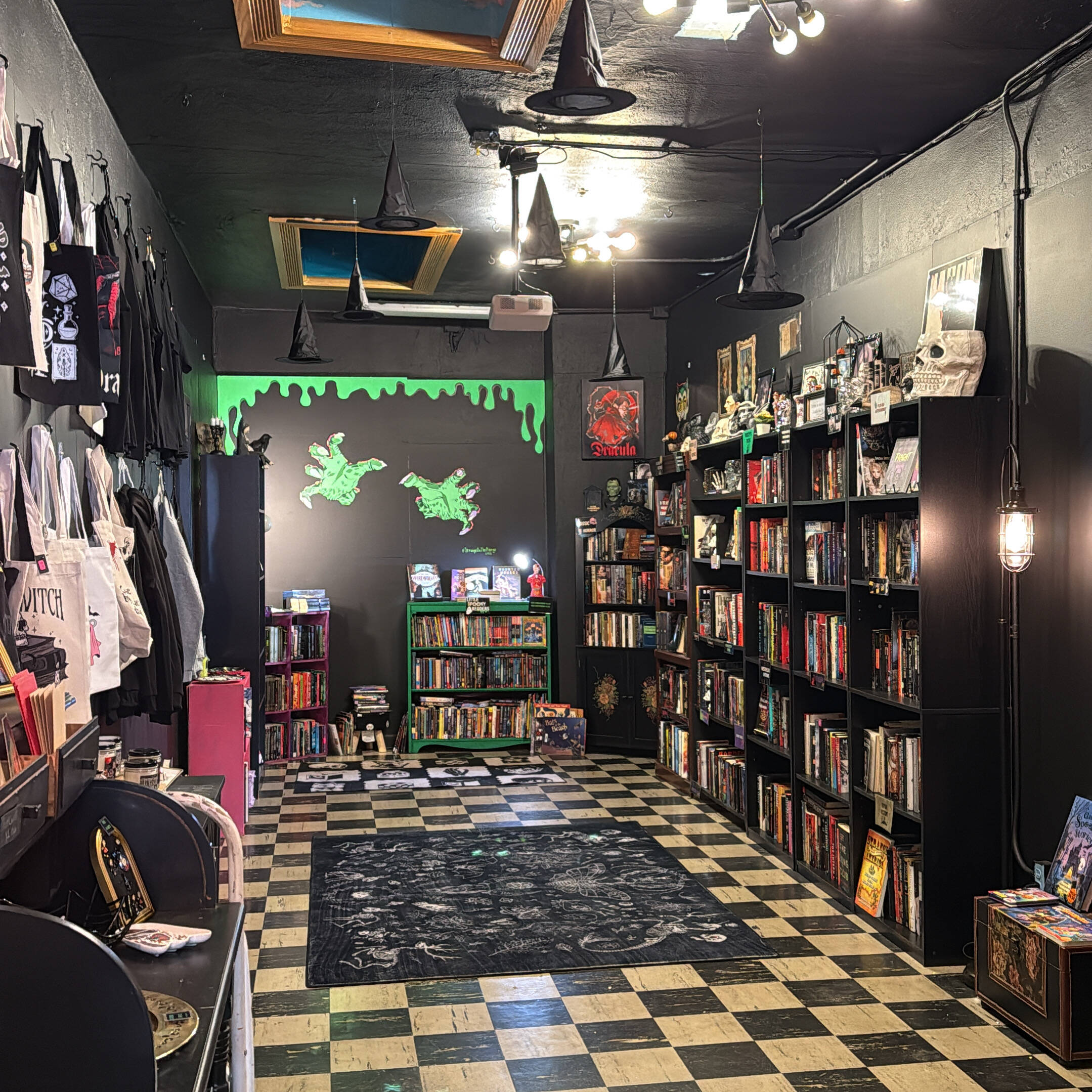 The Horror Den private room inside The Dreadful Bookshop with dark bookshelves and atmospheric decor